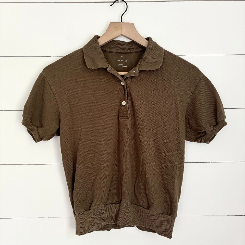 Everlane olive green polo shirt with band around the bottom
